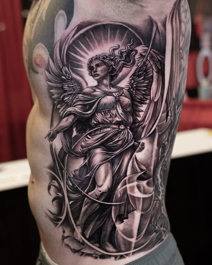 angel tattoo on ribs